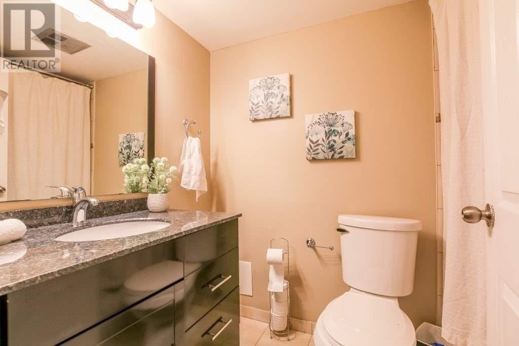Bathroom with dark vanity